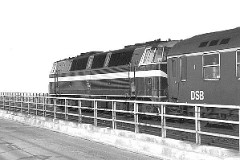DSB MZ class photographed at the Lillebæltsbroen - heading for Middelfart. 9. April 1978. The MZ class (type I and II) was purchased from 1967 to 1970 in a number of 26. Only a few of these engines remain in service by DSB - most are now sold to other companies. Built by NOHAB and Frichs. Dieselelectric. Co'Co'. 2270 kW - 3300 hp. Max speed 143 km/h - 89 mph. Length 20 800 mm. Weight 116,5 metric tonnes.